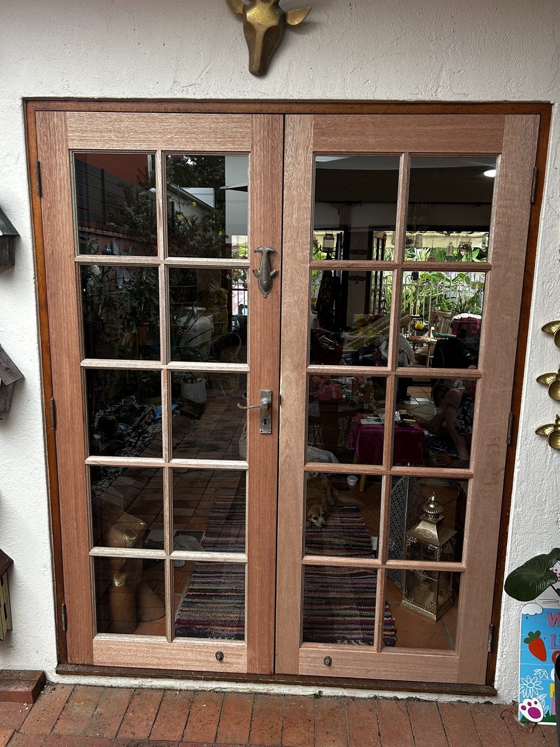 A set of timber french doors with divided glass panes